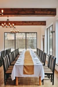 a long table in a room with chairs at Port Jabłonka in Jabłonka +68 photos