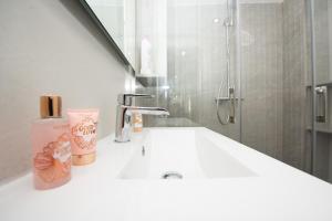 Koupelna v ubytování Benigno Premium Center + 22 fotografií
