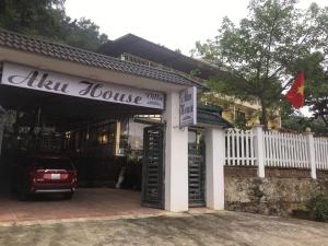 a house with a car parked outside of it at AKU HOUSE Villa Ao vua in Ba Vì