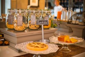 a bakery display with jars of food and desserts at Colletto AgriBioRelais in Villongo SantʼAlessandro