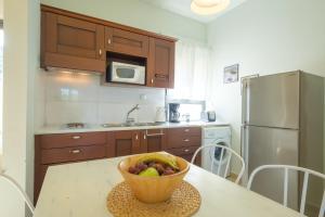 A kitchen or kitchenette at Trochalo Villas