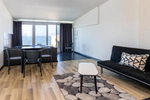 a living room with a couch and a table at Albergaria Pedra D'Ouro in São Pedro de Moel +61 photos