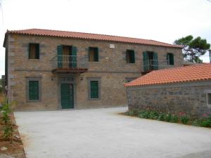 a large brick building with a lot of windows at Terra Lemnia A in Repanídhion