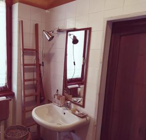 a bathroom with a sink and a mirror at Il Bogno B&B in Lierna