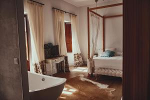 Postel nebo postele na pokoji v ubytování HOTEL LUZ ALMONASTER