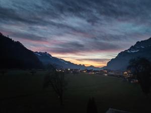 a sunset in the mountains with a road at Schöne Wohnung in Walenstadt in Walenstadt