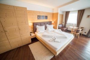 Postel nebo postele na pokoji v ubytování Hotel Pra Tlusel