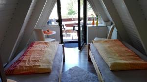 Säng eller sängar i ett rum på Ferienhaus Mauer Krombachtalsperre, exclusive Nebenkosten Strom