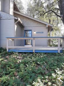 a house with a office sign on the front of it at Alta Sierra Village Inn in Grass Valley