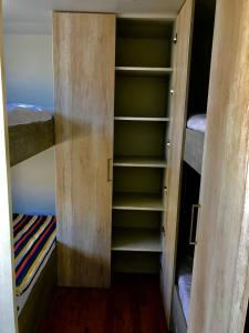 a walk in closet with two bunk beds at Patitos in Huarmey