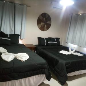 מיטה או מיטות בחדר ב-Vila Do Pescador