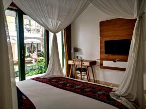 Tempat tidur dalam kamar di Sabana Ubud