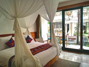 Tempat tidur dalam kamar di Sabana Ubud