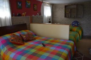 Postel nebo postele na pokoji v ubytování El Pedregal Sopó