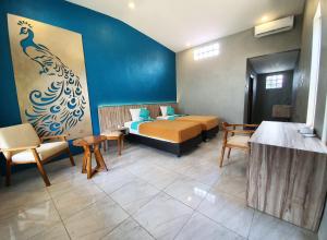 Sanur Agung Suite客房内的一张或多张床位