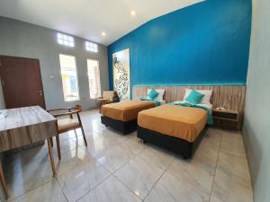 Sanur Agung Suite客房内的一张或多张床位