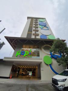 a fedex building with a for sale sign on it at POP! Hotel Diponegoro in Surabaya