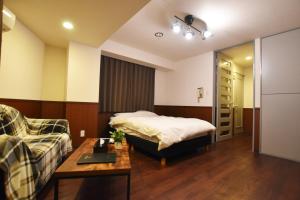 A bed or beds in a room at Randor Residence Tokyo Classic