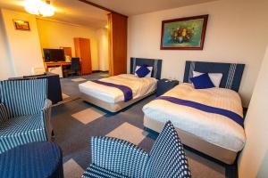 Postel nebo postele na pokoji v ubytování SPA Inn Shirahama