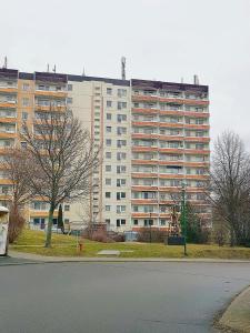 a large apartment building in front of a building at Ferienwohnung 131 in Annaberg-Buchholz