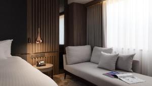 Postel nebo postele na pokoji v ubytování The Howard Plaza Hotel Kaohsiung