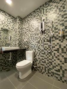 a bathroom with a toilet and a shower at YipStay in Gopeng +43 photos