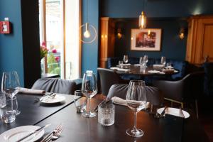 a table in a restaurant with wine glasses on it at Hotel Detmolder Hof in Detmold +64 photos
