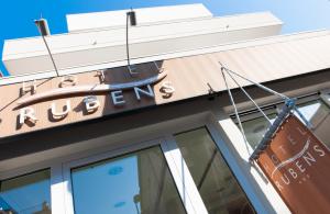 a sign on the front of a building at Hotel Rubens in Rimini