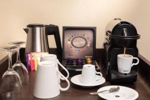 Set per la preparazione di tè e caffè presso Hotel Victoria