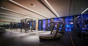 a gym with two treadmills and a treadmill at EQ Kuala Lumpur in Kuala Lumpur