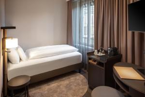 Letto o letti in una camera di Hotel Victoria