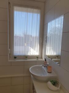 A bathroom at Bella Apartman