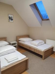 A bed or beds in a room at Bella Apartman