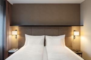Letto o letti in una camera di Hotel Victoria