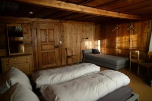 Ένα ή περισσότερα κρεβάτια σε δωμάτιο στο Hotel Alpina