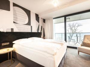 Posteľ alebo postele v izbe v ubytovaní VacationClub – Seaside Apartament 410