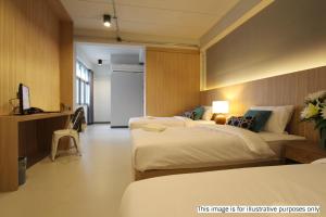 Postel nebo postele na pokoji v ubytování Rajthani Hotel - SHA Certified