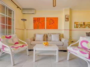 a living room with two chairs and a couch and a table at Apartment Don Pepe-1 by Interhome in Balcon del Mar