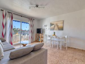 a living room with a couch and a table at Apartment Don Pepe-5 by Interhome in Balcon del Mar