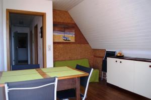 a dining room with a table and chairs at Haus Rebstein in Immenstaad am Bodensee