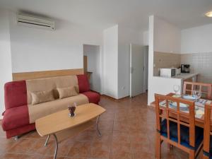 a living room with a couch and a table at Apartment Josipa-1 by Interhome in Klenovica