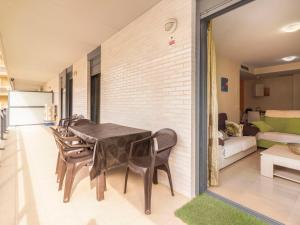 a dining room with a table and chairs at Apartment La Goleta bajos by Interhome in Cambrils