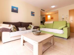 a living room with two couches and a coffee table at Apartment La Goleta bajos by Interhome in Cambrils