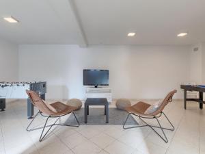 TV a/nebo společenská místnost v ubytování Holiday Home Villa Beach Front by Interhome