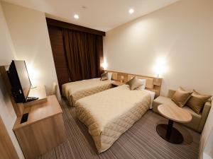 Postel nebo postele na pokoji v ubytování UNIZO INN Osaka Kitahama