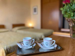 Postel nebo postele na pokoji v ubytování Hotel Ristorante SASSO