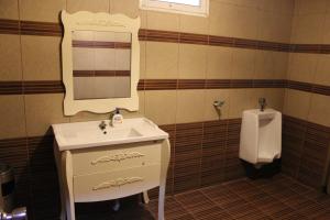 Vonios kambarys apgyvendinimo įstaigoje Million Mansion