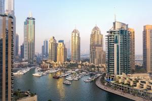 a view of a city with boats in the water at Dusit Princess Residences Dubai Marina in Dubai