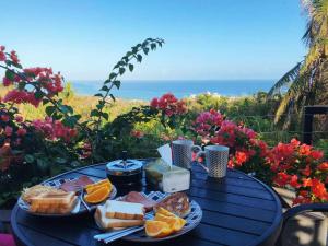 a blue table with a plate of food on it at Saipan Skyline Designers Hotel in Saipan