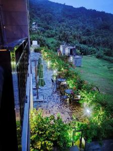 a balcony of a house with a table and chairs at Saipan Skyline Designers Hotel in Saipan